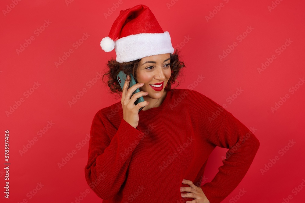 Lifestyle Concept - Portrait of beautiful Caucasian joyful woman talking on mobile phone with friend. Yellow pastel studio background. Copy Space. Lifestyle Concept - Portrait of beautiful Caucasian joyful woman talking on mobile phone with friend. Yellow pastel studio background. Copy Space.
