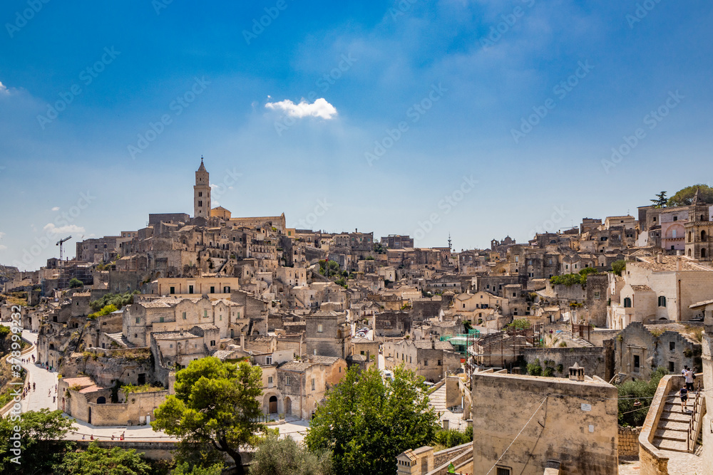Matera, Basilicata, Italy - Panoramic view of the Civita and the Sasso Barisano. The ancient houses of stone and brick, carved into the rock. The Sassi of Matera.