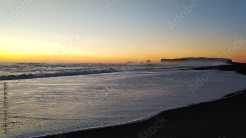 Winter landscape, oceanic beach with black volcanic sand in iceland © Kate