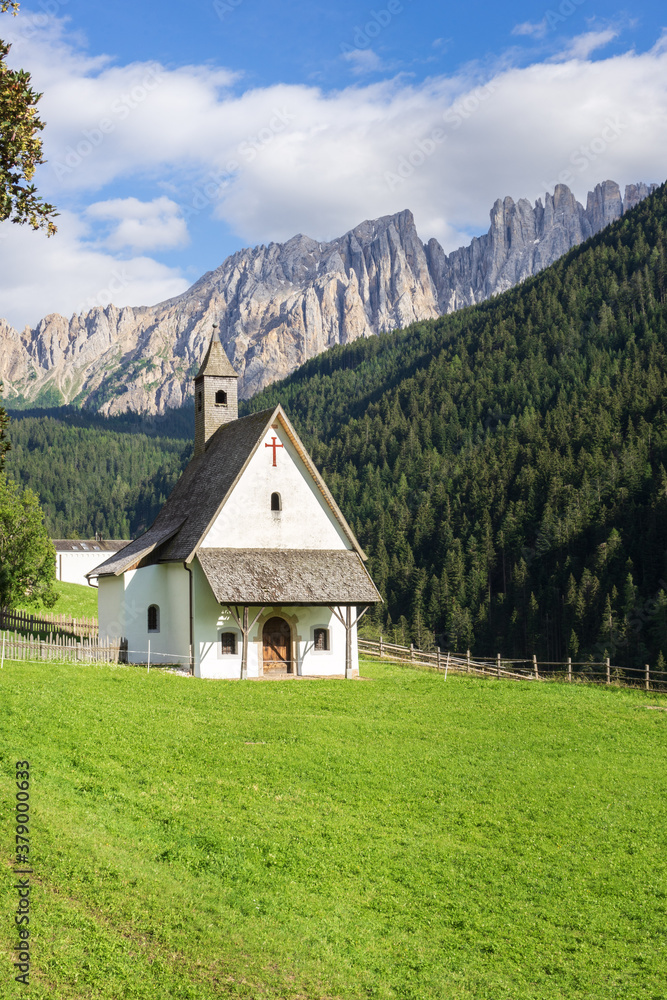 saint sebastian church and latemar mountain, nova levante (Welschnofen)  Alps, Dolomites, italy 