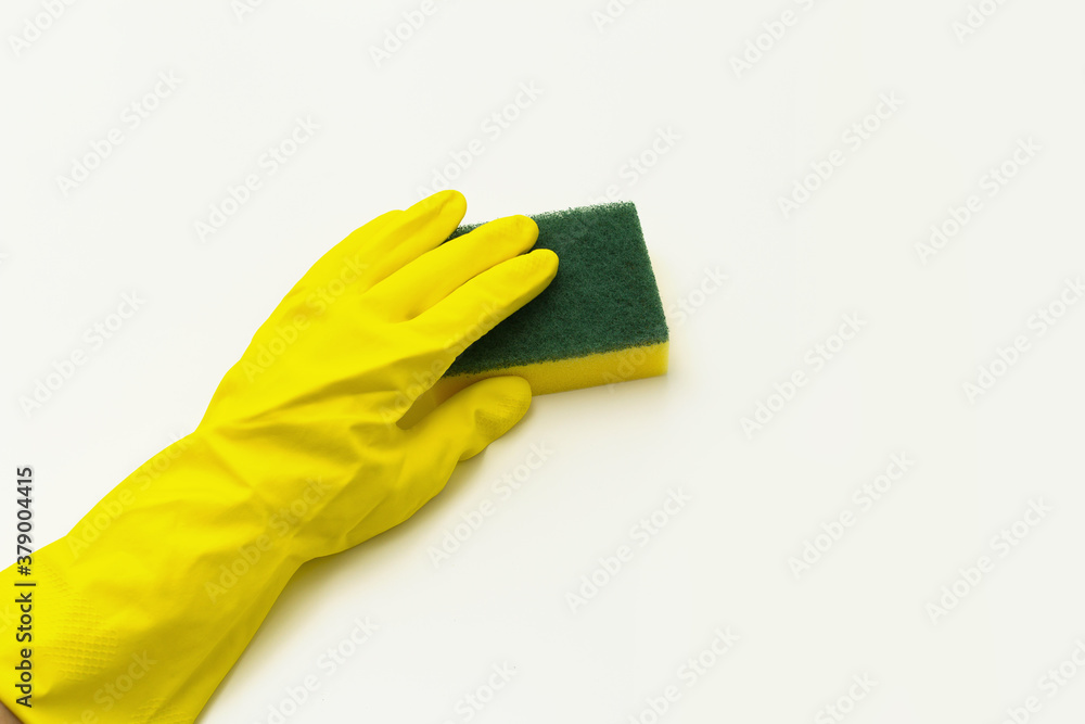 hand in yellow glove with sponge hand in yellow glove with sponge