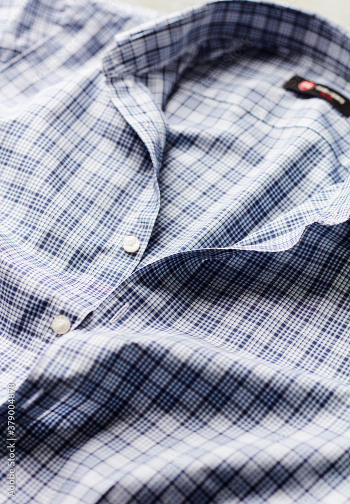 Close up of Men's checkered shirt.	
