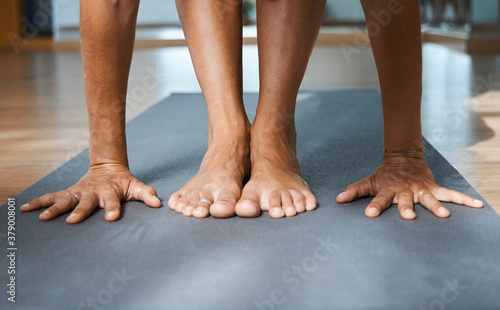 Billede på lærred Standing Forward Bend pose in yoga iyengar, Uttanasana fold pose close up front