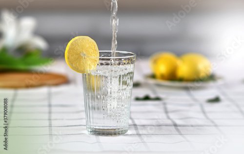 pouring water into a glass