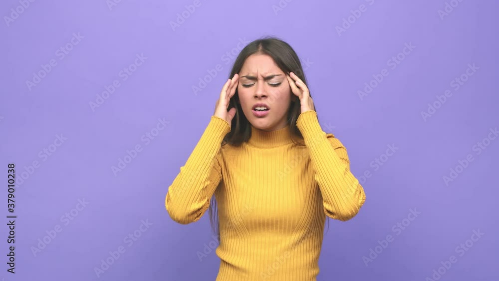 Young cute woman touching temples and having headache Young cute woman touching temples and having headache
