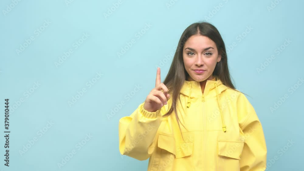 Young cute woman showing number one with finger