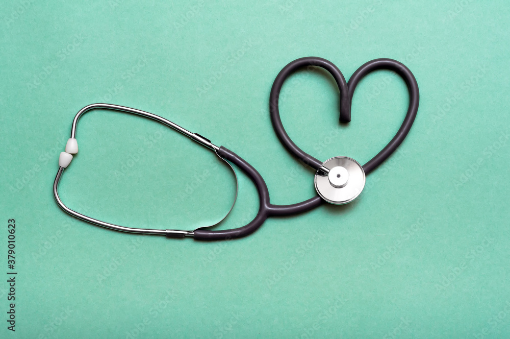 Stethoscope in Shape of Heart Isolated On Green Background. Stethoscope in Shape of Heart Isolated On Green Background.