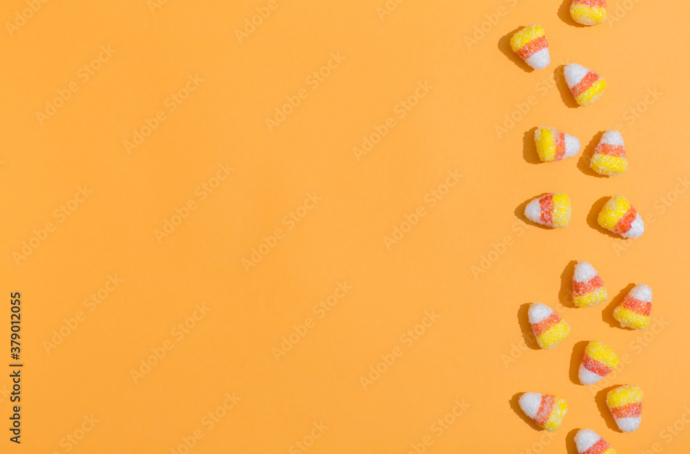 Halloween theme with candies on a orange background