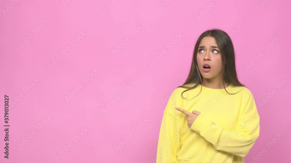 Young cute woman pointing to the side Young cute woman pointing to the side