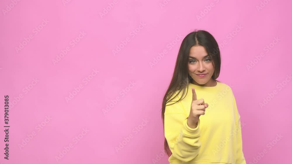 Young cute woman showing number one with finger Young cute woman showing number one with finger