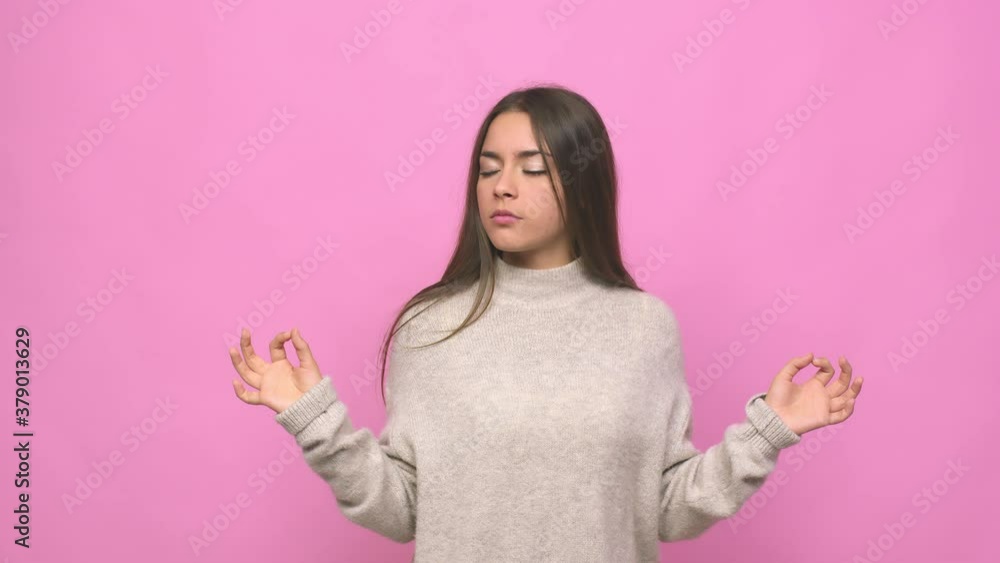 Young cute woman relaxes after hard working day, she is performing yoga Young cute woman relaxes after hard working day, she is performing yoga