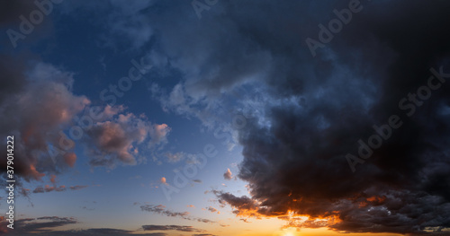 Summer sunset sky high resolution panorama with fleece colorful clouds. Evening dusk good weather natural background. © wildman