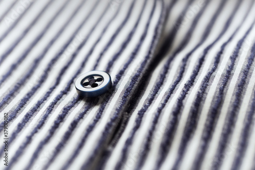 Close up of men's striped shirt. Cotton fabric. 