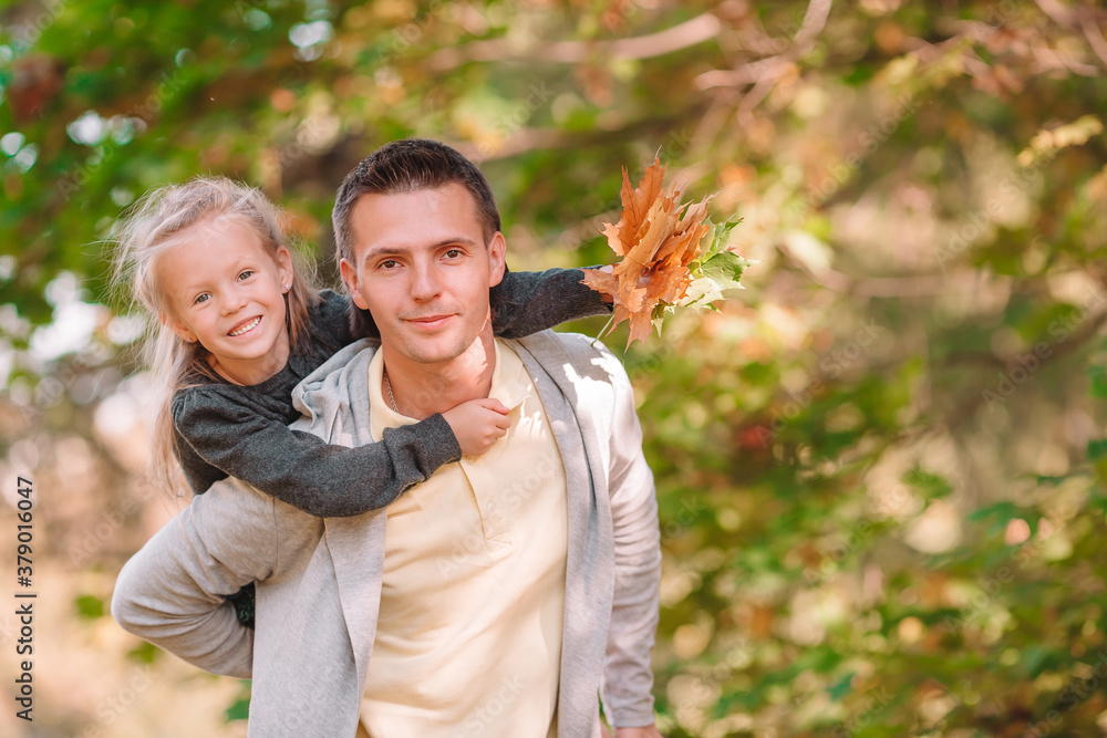 Family of dad and kid on beautiful autumn day in the park Family of dad and kid on beautiful autumn day in the park