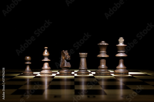 chess pieces on black background