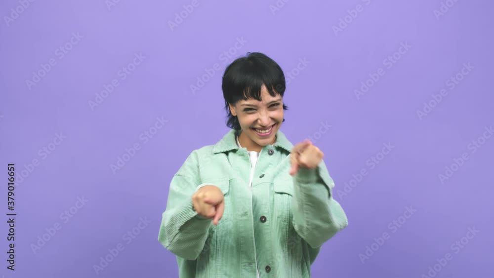 Young caucasian woman cheerful and smiling pointing to the front with both hands Young caucasian woman cheerful and smiling pointing to the front with both hands