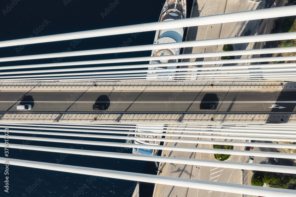 Road and traffic. Aerial view on the cruise ship and bridge in the port. Adventure and travel. Mediterranean sea at sunny day. Travel - image Road and traffic. Aerial view on the cruise ship and bridge in the port. Adventure and travel. Mediterranean sea at sunny day. Travel - image