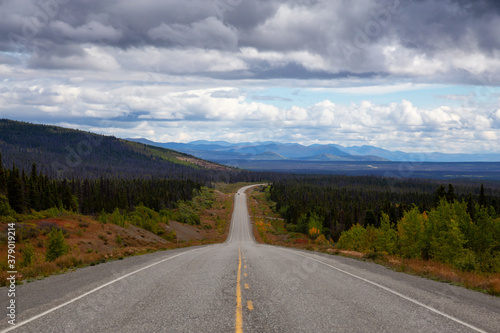 Scenic Route, Alaska Hwy, during a sunny and cloudy day. West of Whitehorse, Yukon, Canada.