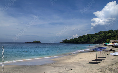 Balinese White Sand Beach with the waves in a sunny day  Bali  Indonesia.  