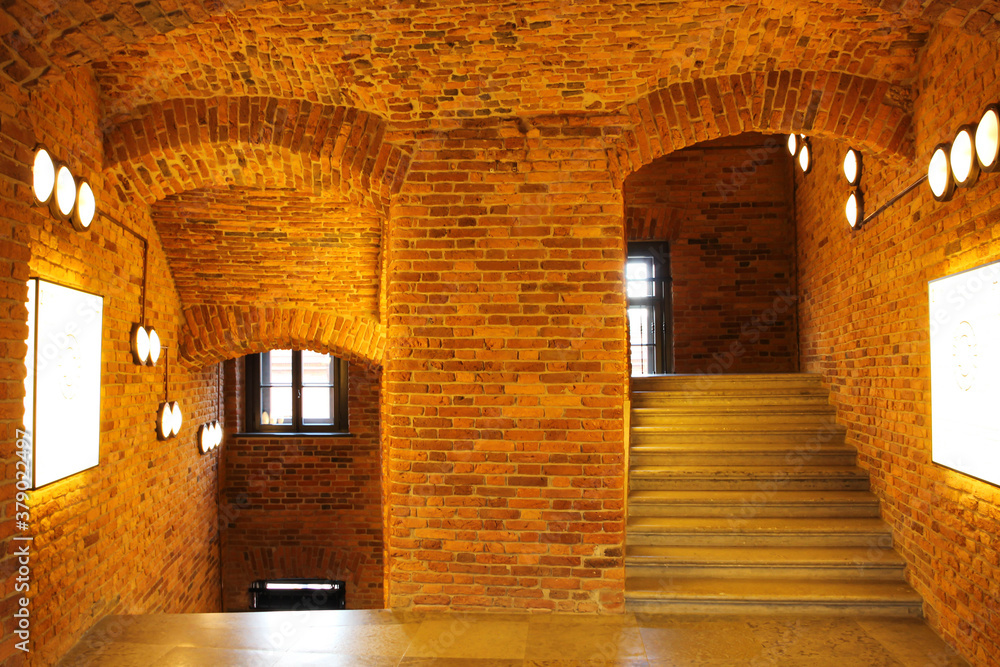 Fototapeta premium Corridor and steps made of red brick