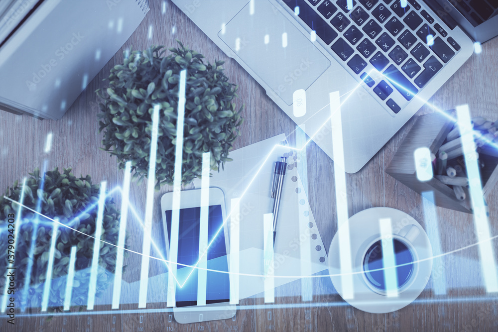 Multi exposure of financial chart hologram over desktop with phone. Top view. Mobile trade platform concept. Multi exposure of financial chart hologram over desktop with phone. Top view. Mobile trade platform concept.