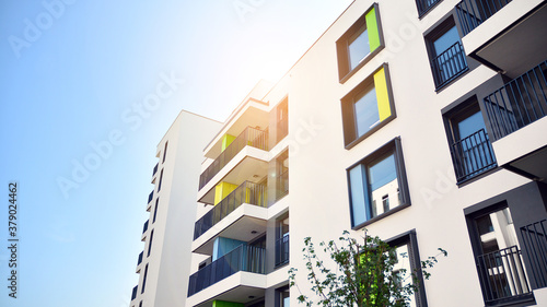 Architectural details of modern apartment building. Modern european residential apartment building complex. Sunset.