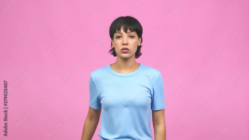 Young caucasian woman keeping a secret or asking for silence, serious face, obedience concept Young caucasian woman keeping a secret or asking for silence, serious face, obedience concept
