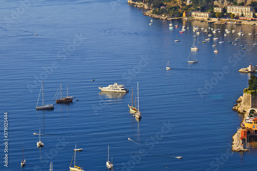 Beautiful top view of Villefranche-sur-Mer bay with boats and yacht. Villefranche-sur-Mer is luxury resort on the French Riviera at Mediterranean Sea, near Nice. France.
