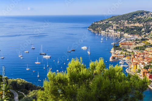 Beautiful top view of Villefranche-sur-Mer bay with boats and yacht. Villefranche-sur-Mer is luxury resort on the French Riviera at Mediterranean Sea, near Nice. France.