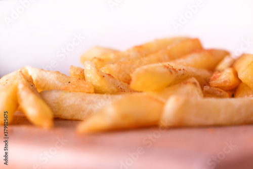 french fries on wooden board.