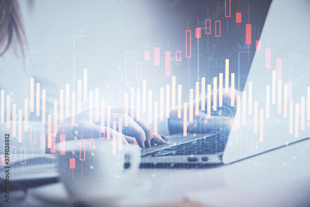 Double exposure of woman hands working on computer and forex graph hologram drawing. Financial analysis concept. Double exposure of woman hands working on computer and forex graph hologram drawing. Financial analysis concept.