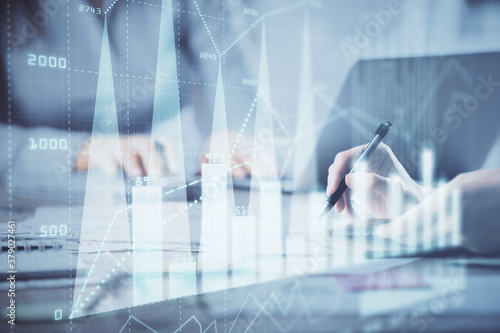 Multi exposure of woman hands typing on computer and financial chart hologram drawing. Stock market analysis concept.