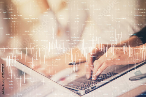 Double exposure of woman hands typing on computer and forex chart hologram drawing. Stock market invest concept.