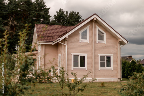 Modern wooden cottage with garden.