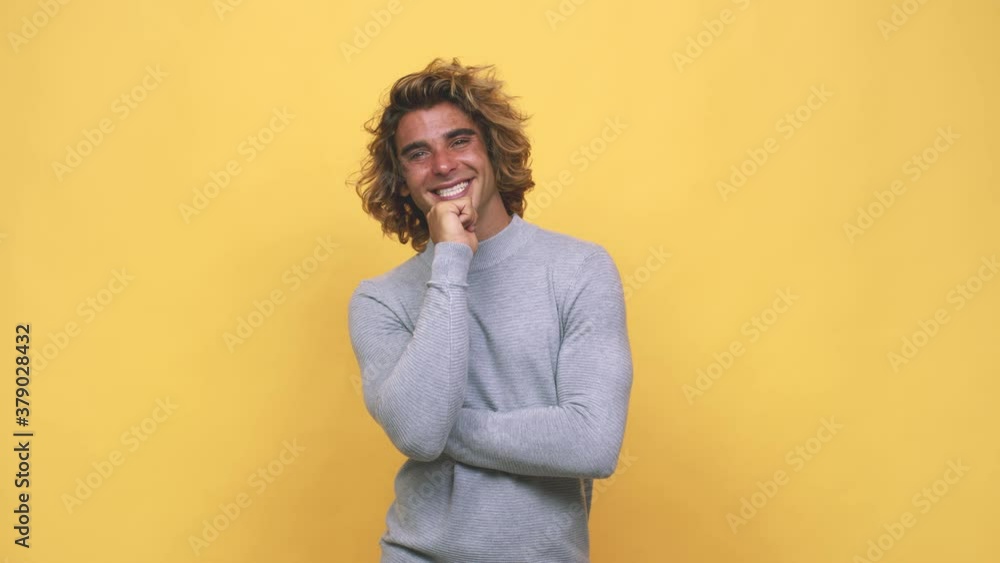 Young cool australian man smiling happy and confident, touching chin with hand Young cool australian man smiling happy and confident, touching chin with hand