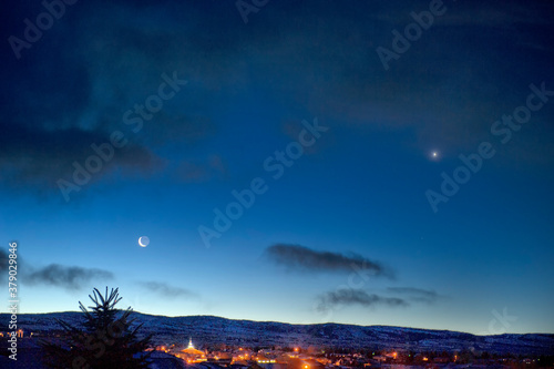 Quarter moon & Venus over Laramie Range at dawn;  Laramie, Wyoming photo