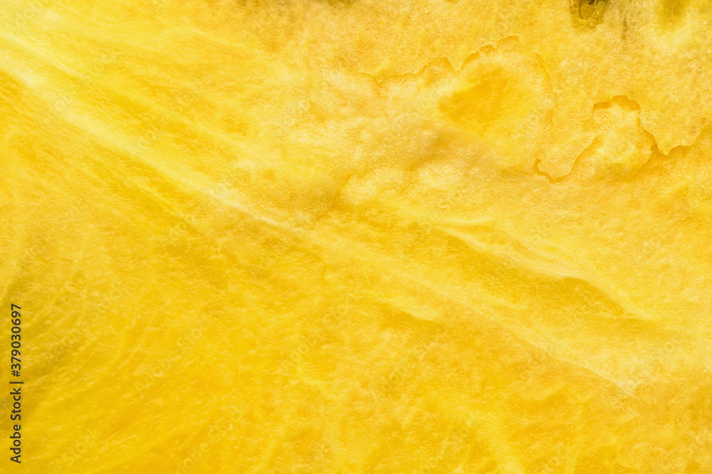 Closeup of fresh yellow watermelon slices on white plate