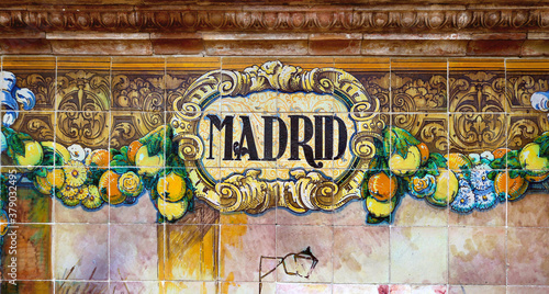 Tile with the name of the spanish city of Jaen on ceramic  with a colorful decoration located in Spain Square in Seville