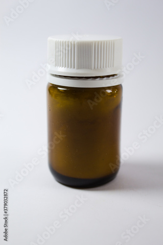 Medicine bottle with white cap