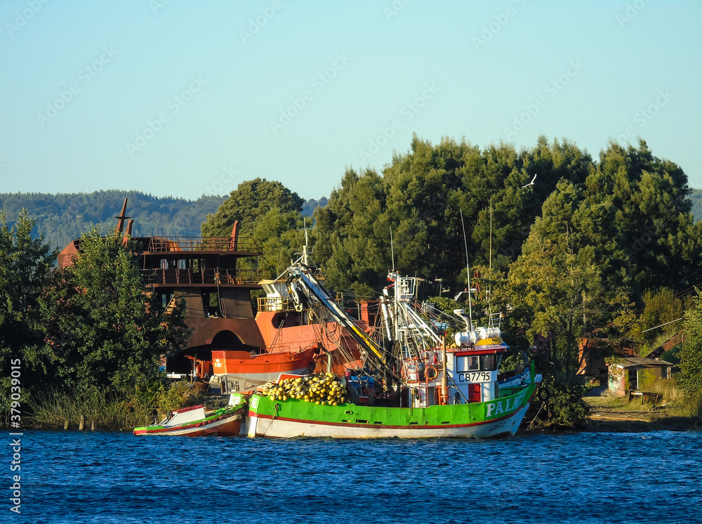 Wrecks and fishing boats close to Valdivia in the south of Chile