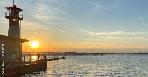 sunset on the lake pier rock harbor