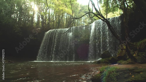 waterfall and lagoon in the rain forest Nabegataki Japan photo