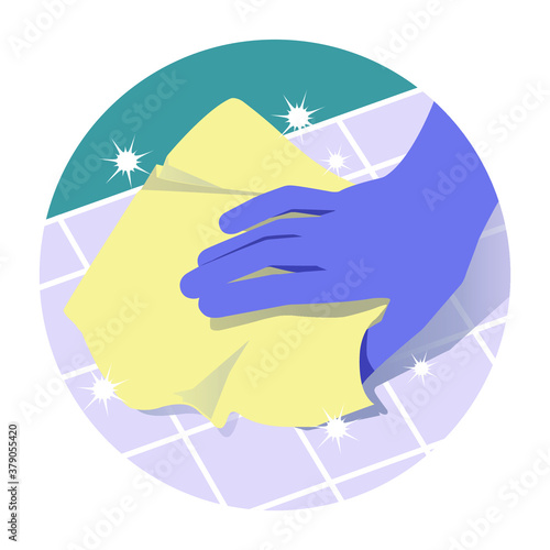 Hand in rubber gloves wiping the surfaces of ceramic tiles.