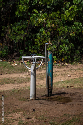 A Water Fountain And A Tap photo