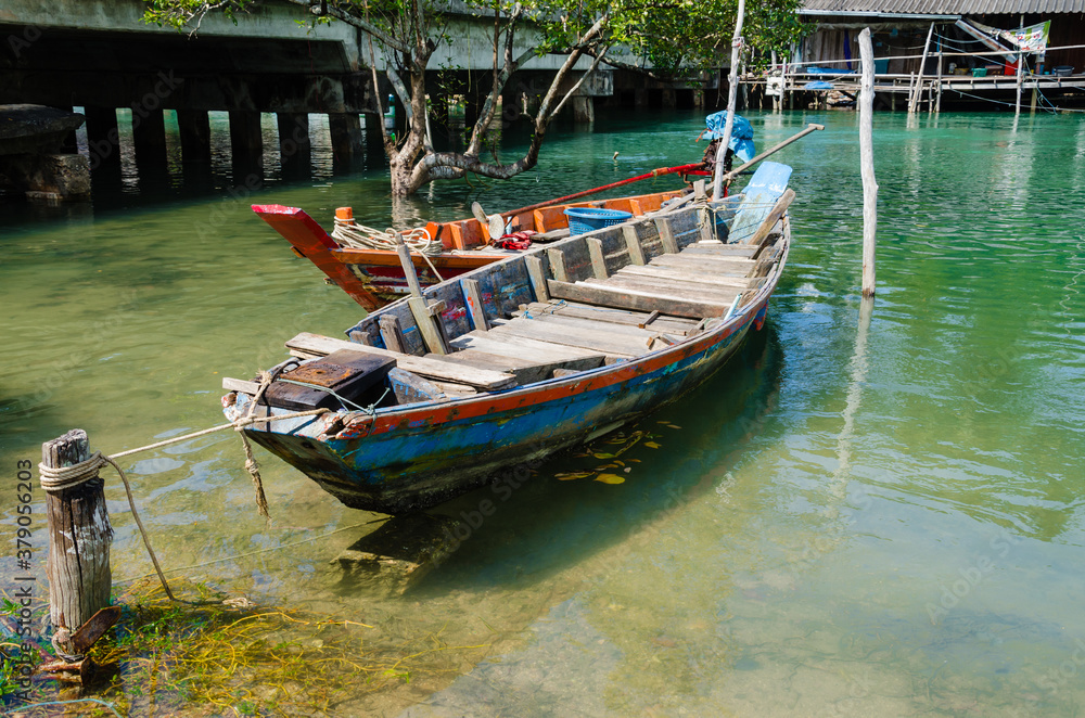 The Fisherman's Boats is Moored on the Clear Water at Southern Province of Thailand.