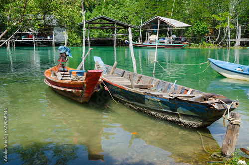 The Fisherman's Boats is Moored on the Clear Water at Southern Province of Thailand.