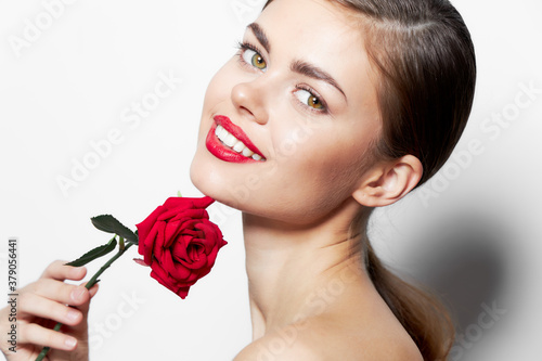Beautiful woman with rose Smile red lips charm bright makeup 