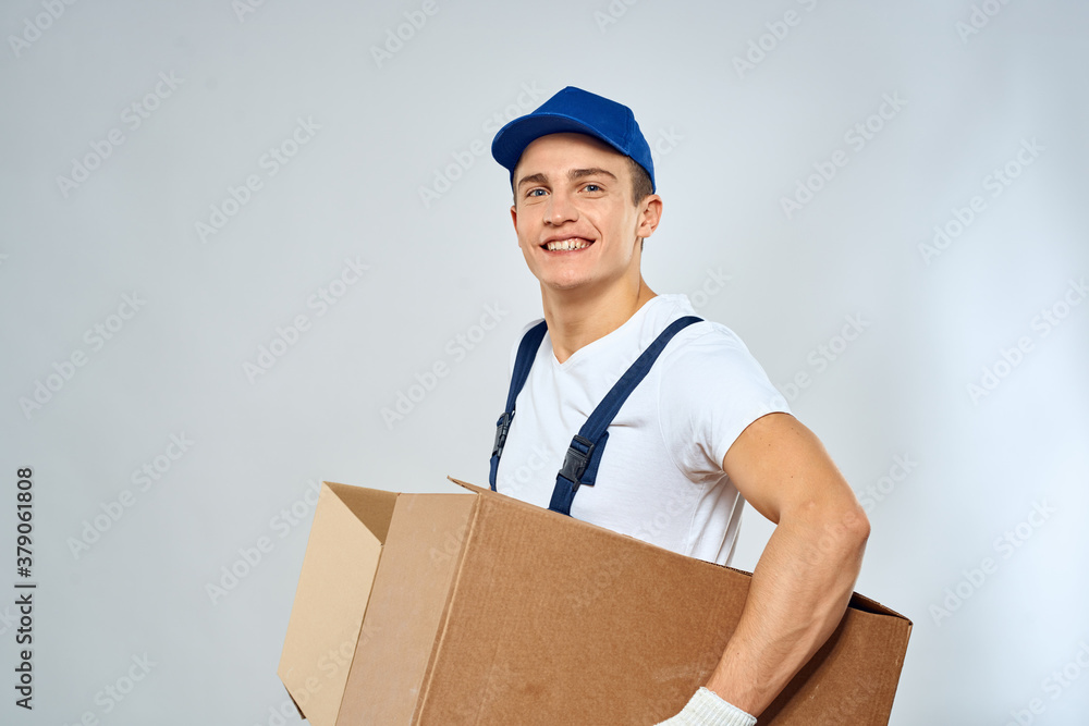 Man worker with box in hands delivery loading service packing service Man worker with box in hands delivery loading service packing service