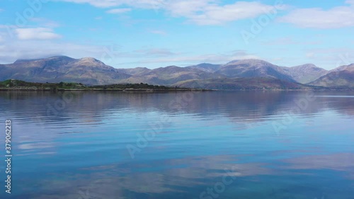 aerial view of balnagowan island and loch linnhe near fort william and ben nevis during a calm clear blue day in autumn in the argyll region of the highlands of scotland photo