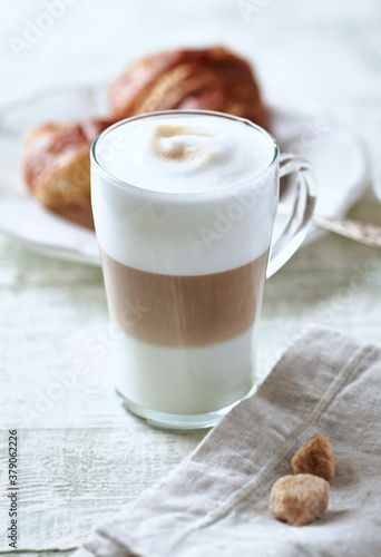 Photos Glass of Latte Macchiato with Croissant